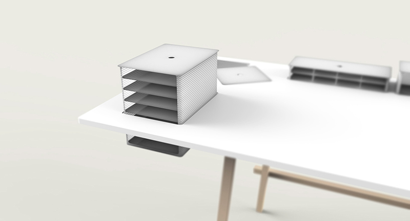 Illustration for article titled A Co-Working Table With Hidden Depths